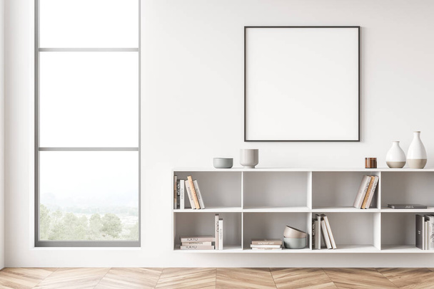 White living room interior with bookshelf, empty square frame and narrow window. Concept of modern interior design. Mock up. 3d rendering - Foto, Imagem