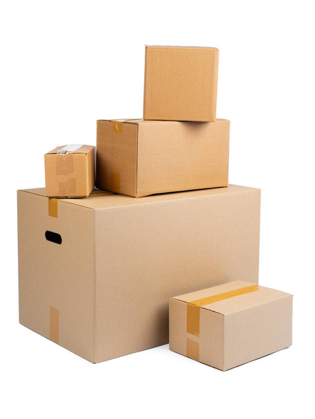 Stack of cardboard boxes isolated on white background - Фото, зображення