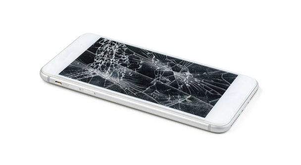 Smartphone with a damaged screen isolated on white background - Foto, Imagem