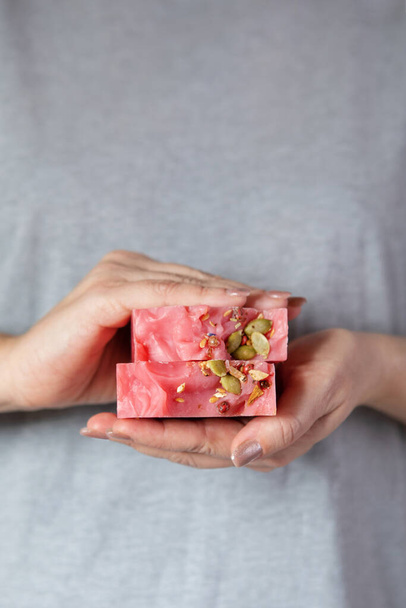 Woman holds a stack of homemade handmade soap. Cherry Cider. Small business, organic products, natural ingredients. - Photo, Image