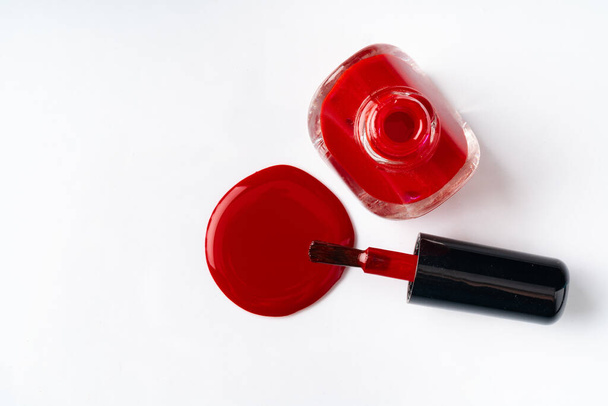Close up of a nail polish puddle over white background - Foto, immagini
