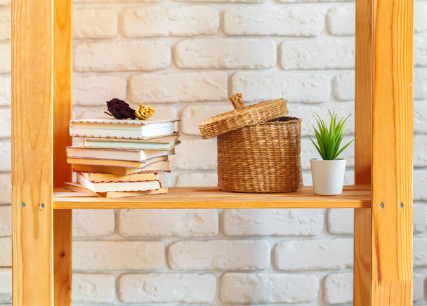 Wooden shelf with home decor on ot - Foto, Imagen