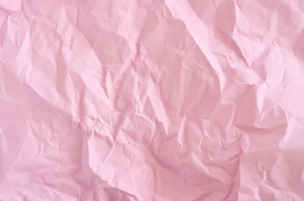 Pink crumpled wrinkled paper pattern surface texture background. - Foto, Imagem