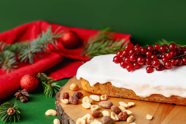 Board with tasty Christmas bread on color background - Фото, изображение
