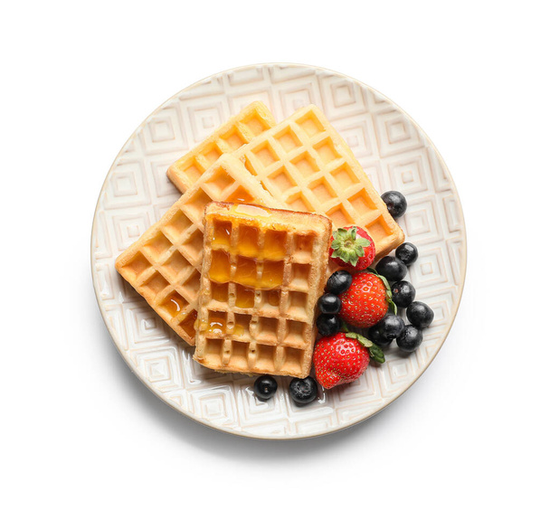 Plate of tasty Belgian Waffles with berries on white background - Valokuva, kuva