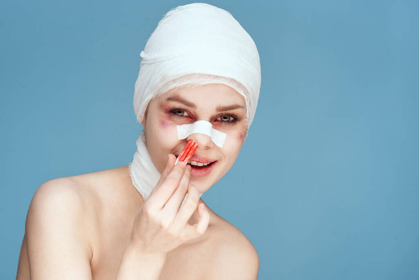 a person tampon in the nose with blood injured face isolated background - Fotó, kép