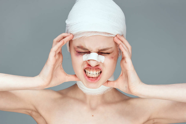 female patient bandaged face health problems close-up - Photo, Image