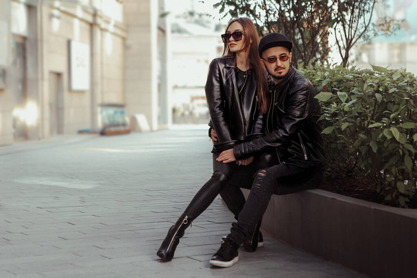 Sexy fashionable coupleposing in the street - Фото, изображение