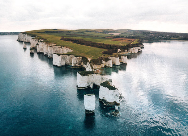 A drone shot of famous old Harry rocks in Dorset - 写真・画像