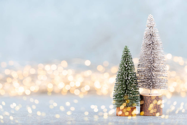 Christmas tree on bokeh background. Christmas holiday celebration concept. Greeting card.  - Zdjęcie, obraz