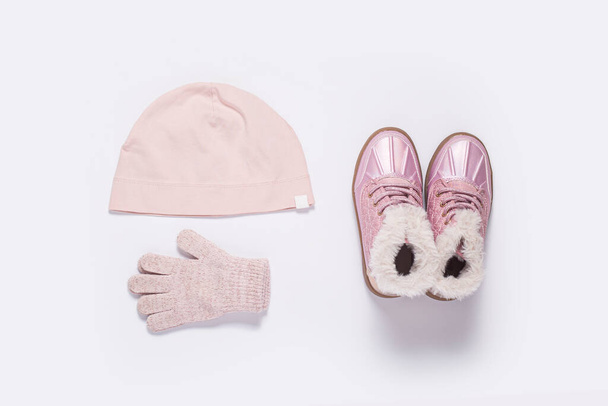 Fashionable children's boots, a hat and gloves for a girl on a white background - Photo, Image