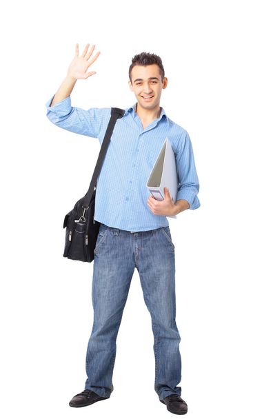 Young man standing with hands in pockets - Foto, afbeelding