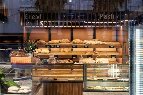 Bakery showcase with assorted baked goods, breads and loaves - Photo, Image