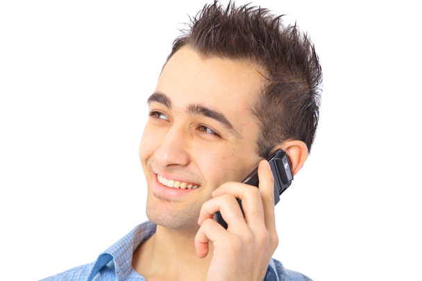 Closeup portrait of a happy young businessman talking on mobile phone - 写真・画像