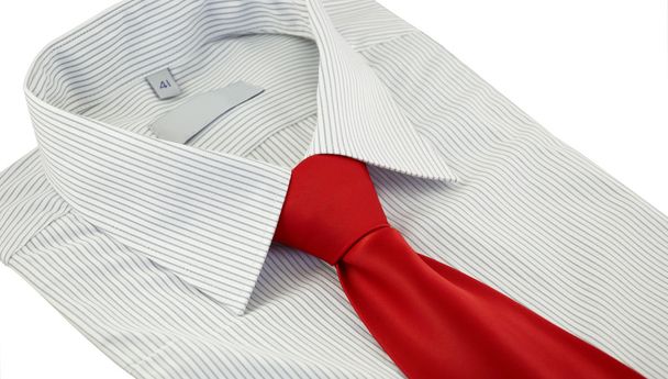 Striped shirt with red silk necktie over white - Foto, afbeelding