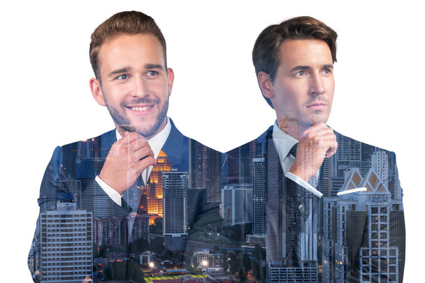 Two handsome businessmen in suits, hand on chin. Asia corporate lifestyle, multinational diverse young professionals. Night Kuala Lumpur city view. Double exposure - Zdjęcie, obraz