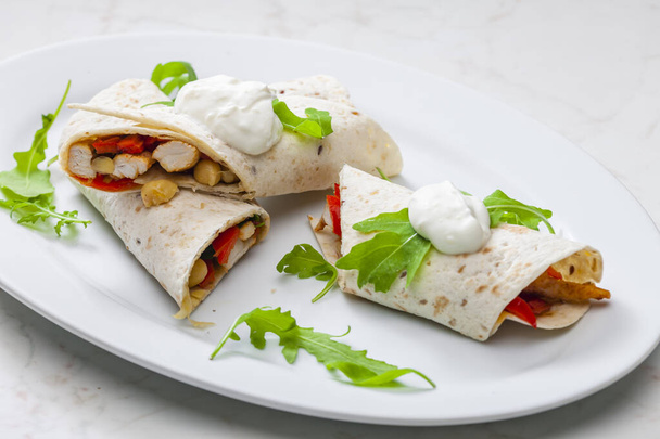 tortilla filled with chicken meat, red pepper and beans - Photo, Image