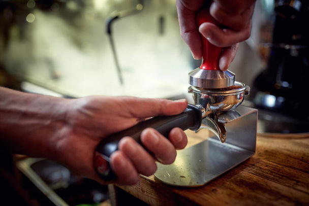 Close-up view on making an aromatic and fragrant espresso. Coffee, beverage, bar - Fotoğraf, Görsel