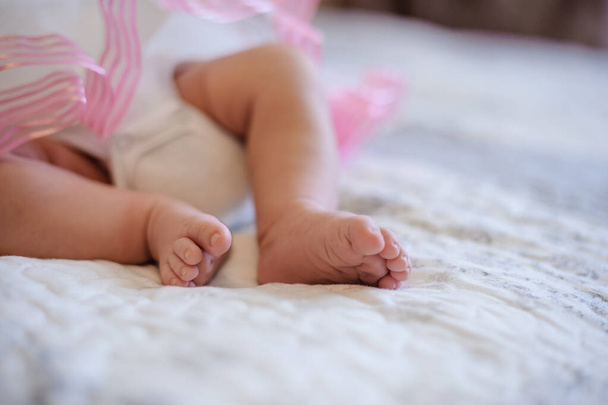 closeup feets of the child on bed - Foto, Imagen