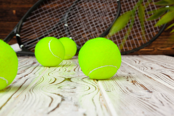 Tennis equipment on wooden surface close up - Photo, image