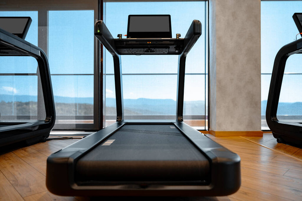 Studio shot of a professional treadmill in modern gym - Φωτογραφία, εικόνα
