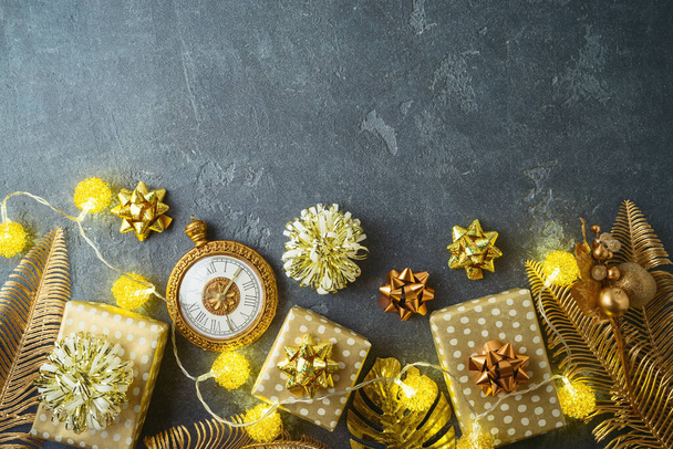 Christmas holiday concept with gift boxes and creative golden decorations. - Foto, imagen