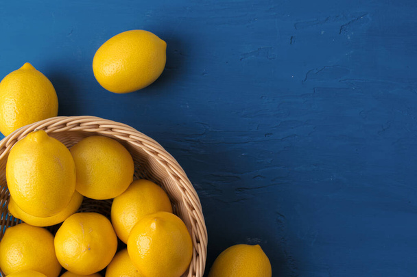 Lemon on classic blue background, top view - Фото, зображення