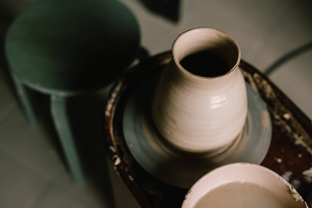 Pottery jugs and cups made of natural clay. Pottery master's workshop. concept is hobby. - Photo, Image