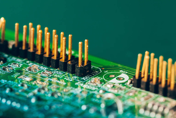 Green circuit board of a computer close up - Fotó, kép