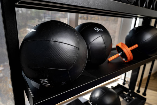 Balls and foam roller sport equipment in a gym - Photo, image