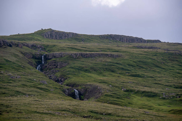 Grassy landscape of a waterfall along Ring Road - Photo, image