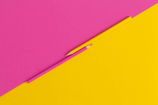 Colored pencils on yellow, pink background. Top view with copy space. Flat lay. Back to school concept. - Foto, Imagen