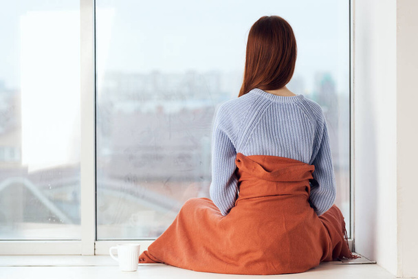 woman near the window dreamy look rest at home comfort - Zdjęcie, obraz