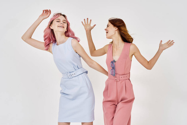 two fashionable girlfriends posing stylish clothes luxury models - Фото, изображение