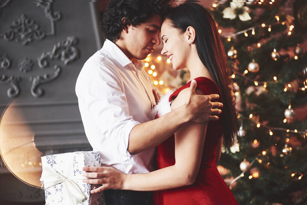 There is present for you too. New Year's evening dancing. Lovely gorgeous couple spending time together. - Foto, imagen