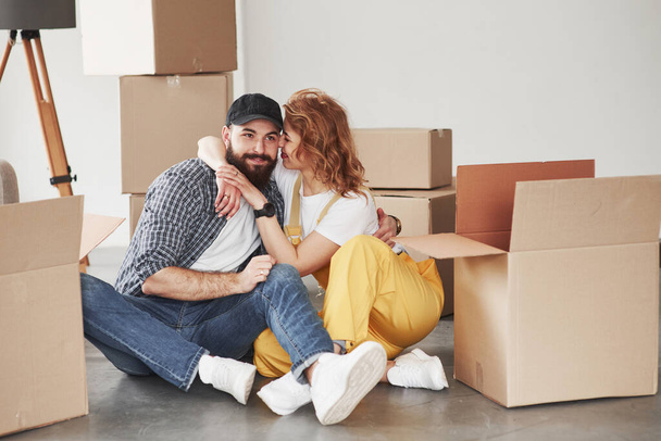 In love with each other. Happy couple together in their new house. Conception of moving. - Fotoğraf, Görsel