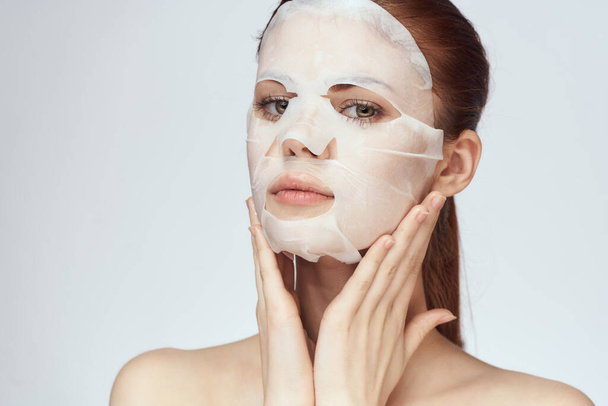 vrouw in cosmetische masker gezichtsverzorging huidverzorging verjonging - Foto, afbeelding