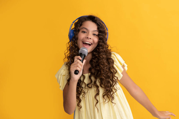 child singer sing karaoke in microphone. online vocal education. back to school. - Photo, Image