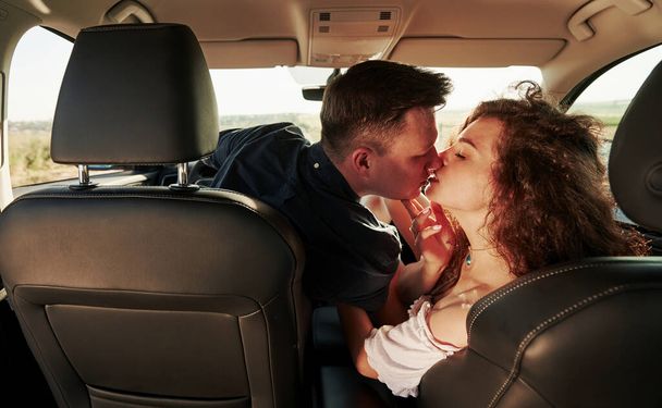 Pure love. Beautiful people is in the modern car at their weekends. - Foto, Imagem