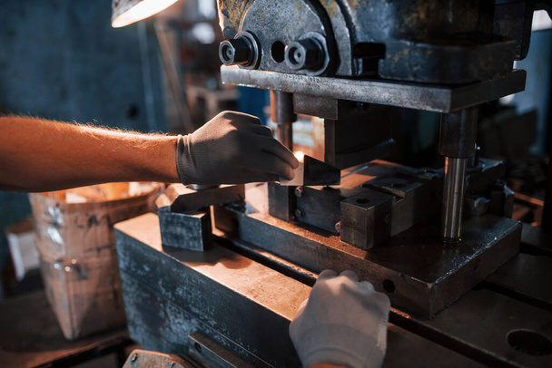 Photo of man's hands works with metal. Industrial conception. - Zdjęcie, obraz