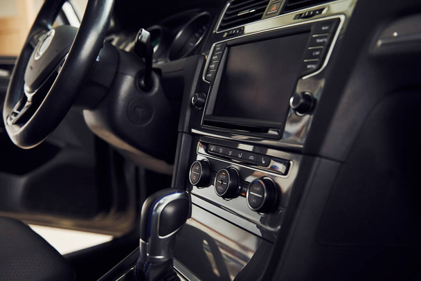 Inside of brand new modern electrical car. Particle view. Cropped photo. - Foto, Imagem