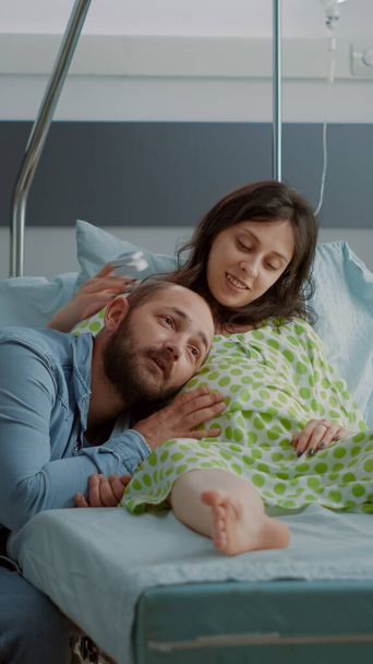 Caucasian man and woman expecting child in hospital ward - Photo, Image