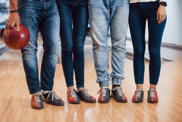 In special shoes. Cropped view of people at the bowling club ready to have some fun. - 写真・画像
