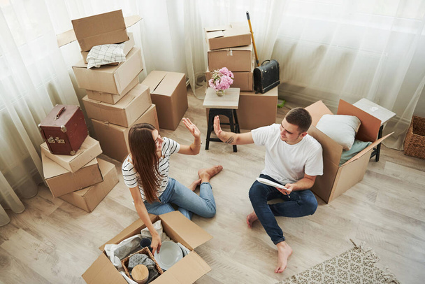 Nice job, it's ours now. Cheerful young couple in their new apartment. Conception of moving. - Foto, Imagem