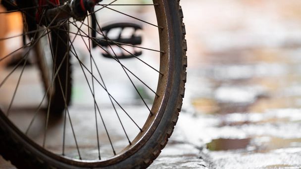 A closeup shot of a bicycle tire on a blurred background - Φωτογραφία, εικόνα
