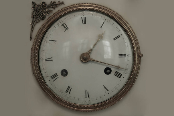 Antique clock face of the ancient watch. isolated  - Zdjęcie, obraz