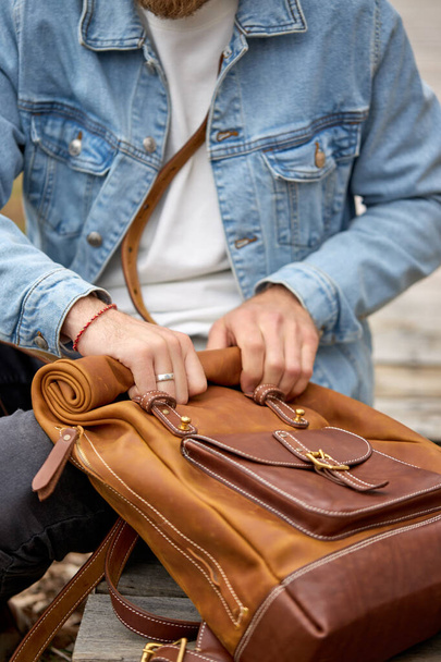 Close up man with leather brown backpack travel, people enjoying lifestyle - Foto, Imagen