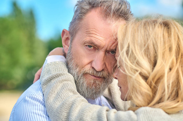 Blonde woman hugging confident bearded man - Photo, Image