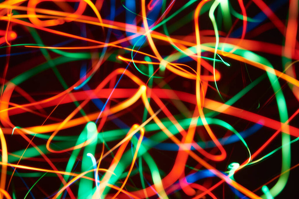 Abstract colorful crazy background, lines of light crisscrossing chaotically throughout the image. - Valokuva, kuva