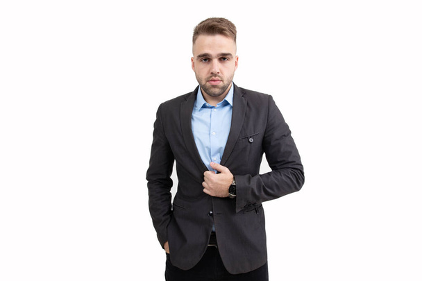 Portrait of a young guy with a jacket and blue shirt on a white background - Foto, Imagen